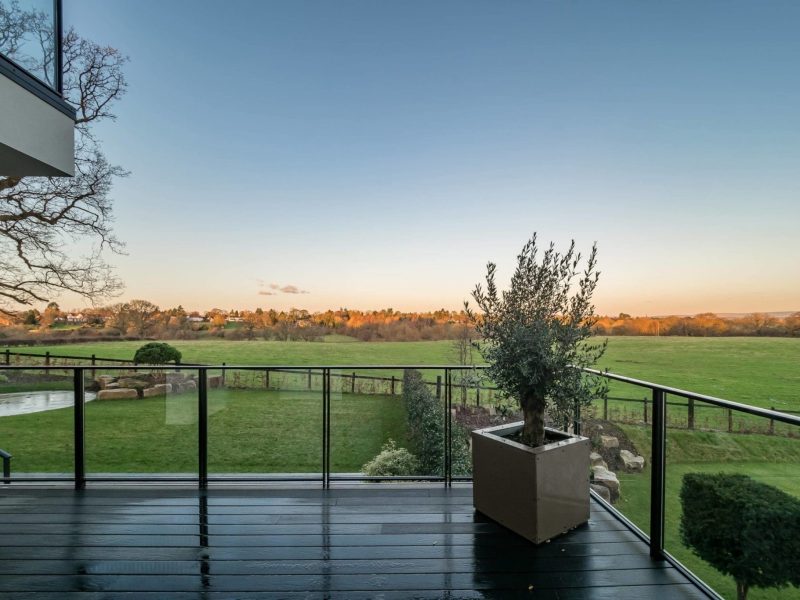 a balcony with a potted plant on it.