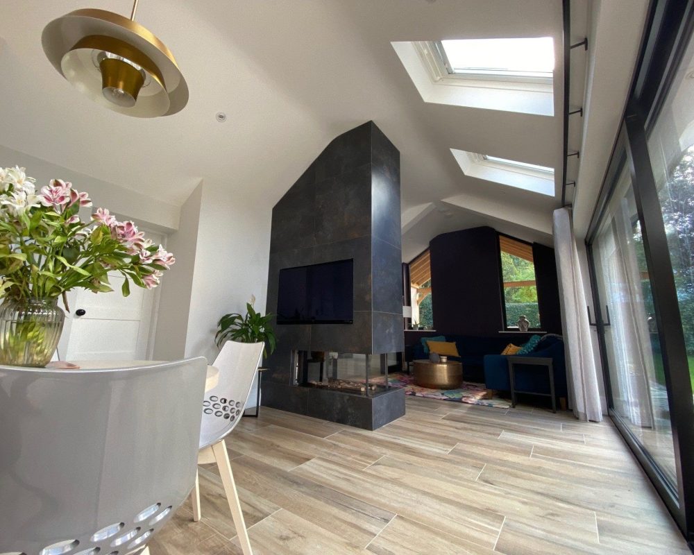 a living room filled with furniture and a fire place.