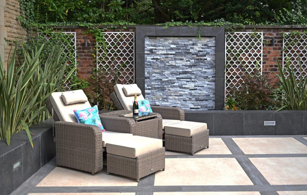 a couple of chairs sitting on top of a patio.