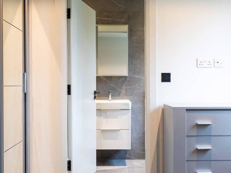 a bathroom with a sink and a mirror.
